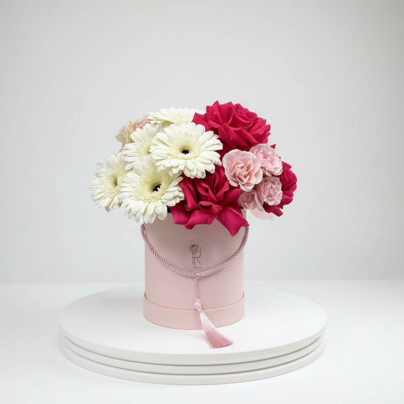 Pink fresh flower box with hot pink roses, light pink spray roses and white gerberas