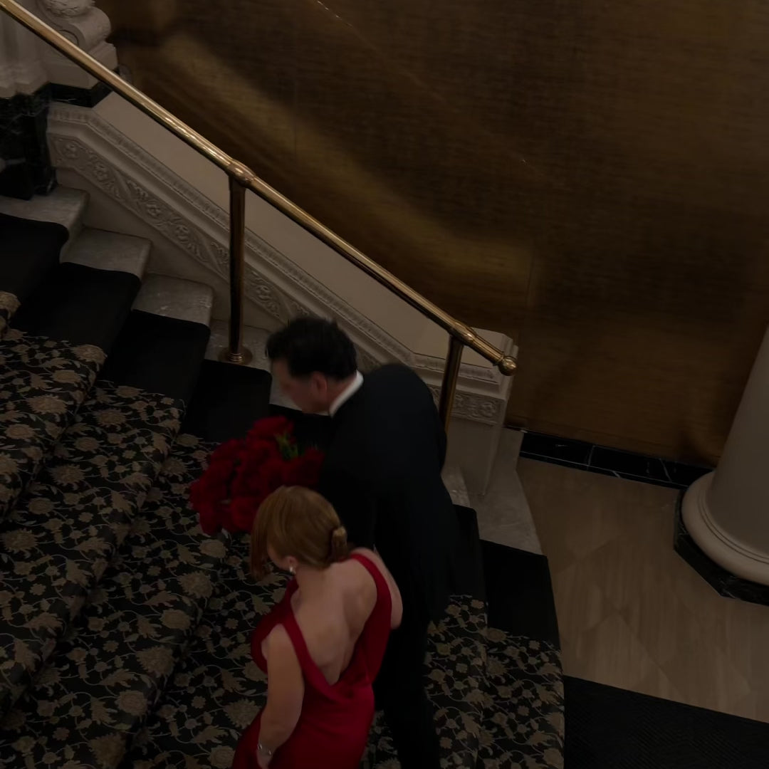 Load video: Short clip of a girl holding various bouquets of roses, tulips, hydrangeas.